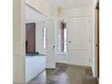 Bright entryway with white doors and slate tile flooring at 574 Bouldercrest Sw Dr, Marietta, GA 30064