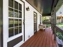 Inviting front porch with wood flooring and stylish seating area at 124 Cagle Way, Hiram, GA 30141