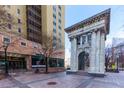 Peachtree Tower's exterior view with a historical monument in the foreground at 300 W Peachtree Ne St # 8E, Atlanta, GA 30308