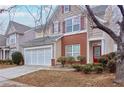 Two-story house with a brick and siding exterior, three-car garage, and landscaping at 3335 Briaroak Dr, Duluth, GA 30096