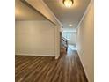 Bright foyer with hardwood floors and view of staircase at 3964 Riverchess Lot 157 Dr, Atlanta, GA 30331