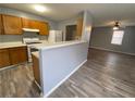 Kitchen features a breakfast bar, wood cabinets, and light gray walls at 967 Metropolitan Sw Pkwy, Atlanta, GA 30310