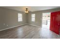 Inviting living room with durable wood-look floors, neutral paint, ceiling fan and abundant natural light at 967 Metropolitan Sw Pkwy, Atlanta, GA 30310