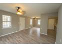 Spacious open floor plan with ceiling fans and wood-look flooring offers flexible living and dining at 967 Metropolitan Sw Pkwy, Atlanta, GA 30310