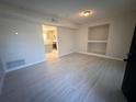 Living room with light gray tile floors and built-in shelving at 1168 Dogwood Nw Ct, Conyers, GA 30012