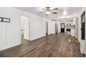 Bright living room with dark gray vinyl flooring and open concept at 125 Clayton St, Fairburn, GA 30213