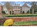 Three-unit townhome community with lush landscaping at 2344 Saint Davids Nw Sq # 2, Kennesaw, GA 30152