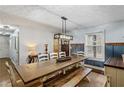 Farmhouse-style dining room featuring a large wooden table at 247 Island Shoals Rd, Covington, GA 30016