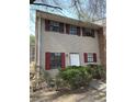 Attractive two-story home featuring neutral siding, red shutters, and tidy shrubbery at 6354 Shannon Pkwy # 2A, Union City, GA 30291