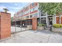 Brick building with gated parking and signage at 505 Whitehall Sw St # 101, Atlanta, GA 30303