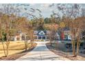 Circular driveway showcasing a beautiful farmhouse at 201 Edwards Brook Ct, Canton, GA 30115