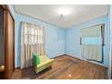 Small bedroom with light blue walls and hardwood floors at 2425 Hillside Ave, Decatur, GA 30032