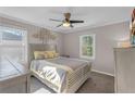 Spacious bedroom with a queen bed, ceiling fan, and ample natural light at 727 Charlotte Nw Pl, Atlanta, GA 30318