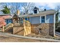 Gray house with stone accents and a large deck at 727 Charlotte Nw Pl, Atlanta, GA 30318
