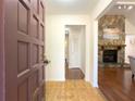 Inviting entryway with a stone fireplace and hardwood floors at 3096 Village Glen Trl, Snellville, GA 30039