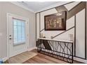 Inviting entryway featuring stylish wall decor, console table and sleek, wood-look floors at 532 Barlow Pl, Grayson, GA 30017