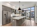 Modern kitchen with island, stainless steel appliances, and hardwood floors at 105 Georgia Se Ave # 3, Atlanta, GA 30312