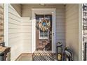 Inviting front door entrance with wreath and lanterns at 132 Marietta Walk Trce, Marietta, GA 30064