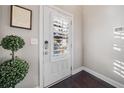 White interior door with wood flooring and plant at 132 Marietta Walk Trce, Marietta, GA 30064