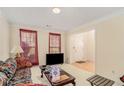 Living room with sofa, coffee table, and view to entryway at 1246 Carriage Trace Cir, Stone Mountain, GA 30087