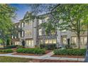 Three-story townhouses with brick exteriors and landscaped yards at 9972 Ashton Old Rd, Douglasville, GA 30135