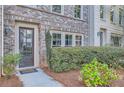 Townhouse front entrance with landscaping at 9972 Ashton Old Rd, Douglasville, GA 30135