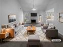 Virtually staged living room featuring gray sofas, a wood coffee table, and a fireplace at 220 Mountain Way, Covington, GA 30016