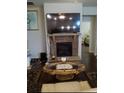 Cozy living room with a stone fireplace and large TV at 780 Codex Dr, Fairburn, GA 30213