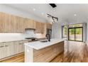 Modern kitchen with light wood cabinets, quartz countertops, and island at 105 Georgia Se Ave # 1, Atlanta, GA 30312