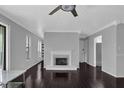 Open living room features fireplace, fan and hardwood flooring at 2510 Cumberland Se Ct, Smyrna, GA 30080