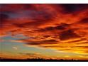 Striking sunset featuring red and orange hues, with the silhouette of a city skyline in the distance at 4382 Benfield Se Way, Smyrna, GA 30080