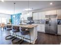 Modern kitchen with stainless steel appliances and granite countertops at 145 Lost Cove Sw Dr, Atlanta, GA 30331