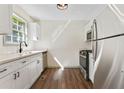 Updated kitchen with stainless steel appliances and white cabinets at 456 Pine Shadows Dr, Dallas, GA 30157