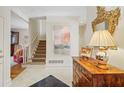 Bright entry with staircase, hardwood floors, and antique furniture at , Atlanta, GA 30327