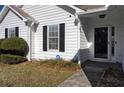 House entrance with black shutters and storm door at 540 Saddle Shoals Dr, Lawrenceville, GA 30046