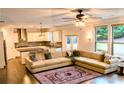 Open living space with large sectional sofa and kitchen views at 1055 Grove Valley Dr, Cumming, GA 30041