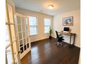 Bright home office with hardwood floors and French doors at 1055 Grove Valley Dr, Cumming, GA 30041