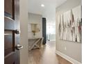 Bright entryway with contemporary art and a sleek console table at 1080 Peachtree Ne St # 1402, Atlanta, GA 30309