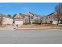 Two-story house with a front yard and driveway at 1491 Saint George Pl, Conyers, GA 30012