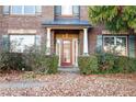 Inviting front door entry with decorative columns and landscaping at 4660 Lake Hill Trl, Ellenwood, GA 30294