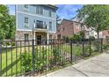 Landscaped front yard with a fence and walkway leading to the house entrance at 2972 Lookout Ne Pl, Atlanta, GA 30305