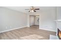 Spacious living room with hardwood floors and a view into the dining area at 3530 Kingsbrooke Ct, Decatur, GA 30034