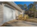 White garage door and attached wooden ramp at 912 Northridge Nw Dr, Conyers, GA 30012