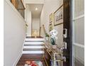 Bright entryway with staircase, console table, and modern decor at 505 Stagecoach Bnd, Smyrna, GA 30080