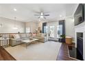 Spacious living room with sectional sofa, fireplace, and hardwood floors at 505 Stagecoach Bnd, Smyrna, GA 30080
