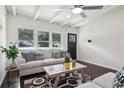 Living room with dark hardwood floors, light walls, and comfortable seating at 2256 Barge Sw Rd, Atlanta, GA 30331