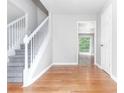 Bright entryway with hardwood floors and staircase at 526 Bass Pointe Nw, Kennesaw, GA 30144