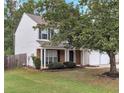 Two-story house with a two-car garage and large tree at 526 Bass Pointe Nw, Kennesaw, GA 30144