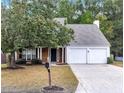 Brick front house with a two-car garage and mature trees at 526 Bass Pointe Nw, Kennesaw, GA 30144