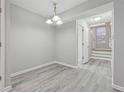 Simple dining area with gray walls and wood-look floors at 6235 Queen Meadow Se Dr, Mableton, GA 30126